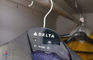 a coat swinger with a button on it