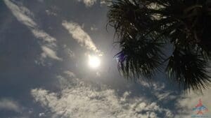 the sun shining through clouds