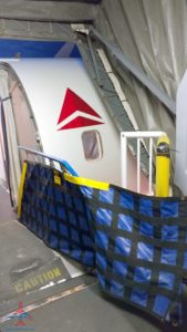 a white airplane with a red triangle on it