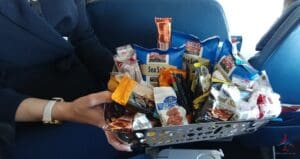 a person holding a basket of food