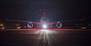 a plane on the runway at night