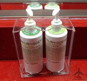 a group of soaps in a clear container