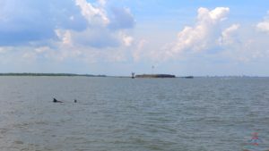 a body of water with land in the background