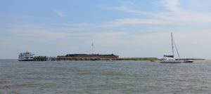 a body of water with a building in the distance