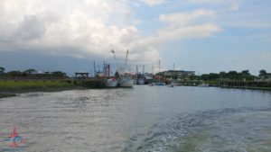 a body of water with boats in the foreground