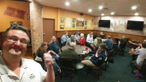 a group of people sitting around a table