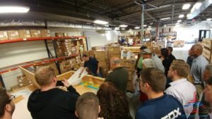 a group of people in a warehouse