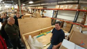 a man sitting in a warehouse