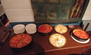 a table with pizzas on it