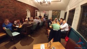 a group of people sitting around a table