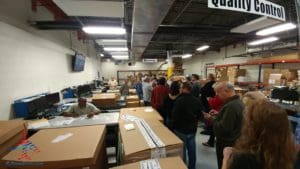 a group of people in a warehouse