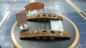 a table with glasses and a sign on it