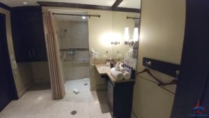 a bathroom with a shower and a sink
