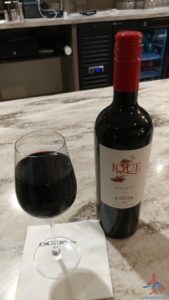 a bottle of wine and a glass of wine