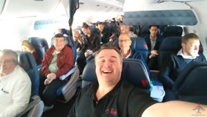 a man taking a selfie in an airplane