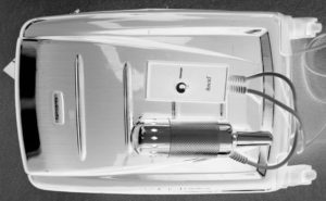 a silver object with a light switch