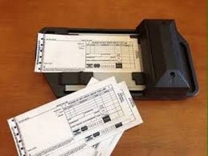 a machine with several papers on it