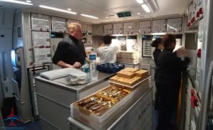 a man standing behind a counter in a kitchen