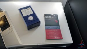 a blue box and a red and blue box on a white surface