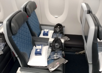 a seat with a few bags on it