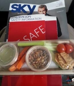 a tray of food and magazines