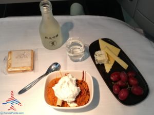 a plate of food and a bottle of water