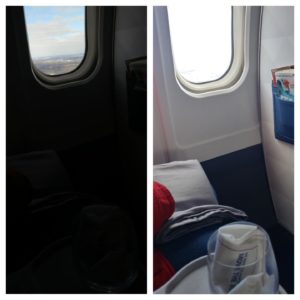 a plane window with a glass and a bottle