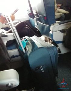 a group of luggage on an airplane