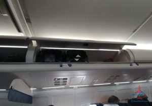 a shelf with luggage on top of it