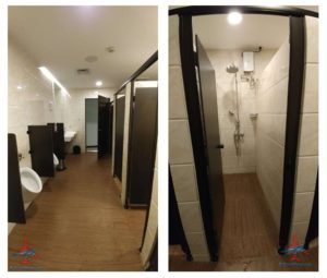 a bathroom with a toilet and a urinal