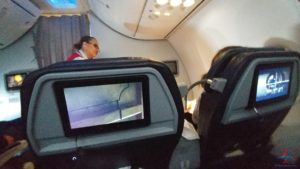 a woman sitting in an airplane