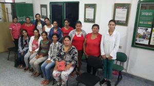 a group of women standing in a room