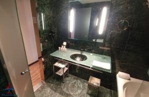 a bathroom with a mirror and sink