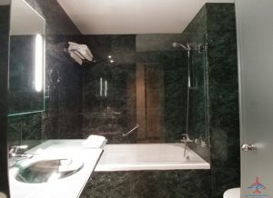 a bathroom with a bathtub and a sink