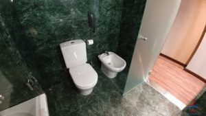 a toilet and bidet in a bathroom