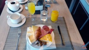 a plate of food and drinks on a table