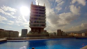 a building next to a pool