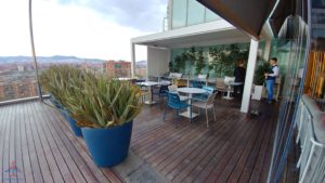 a patio with tables and plants