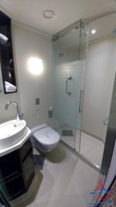 a bathroom with a glass shower door