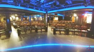 a room with chairs and a blue strip of light