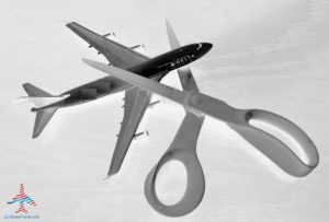 a plane and scissors in the air