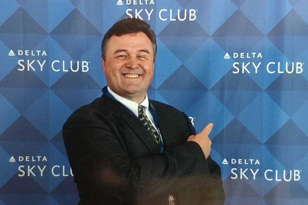 Travel blogger Rene de Lambert poses at the ATL Atlanta B concourse Sky Club grand opening.