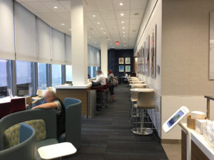 people sitting at a counter in a room