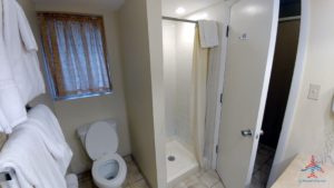 a bathroom with a shower and toilet