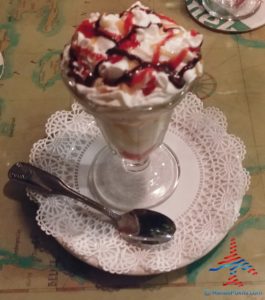 a dessert in a glass with a spoon