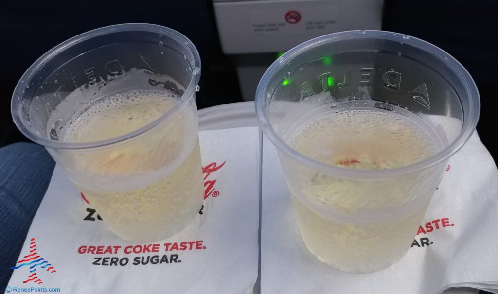 two plastic cups of soda