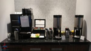 a coffee machine and coffee maker on a counter