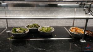 a row of bowls of food