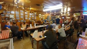 a group of people sitting at tables