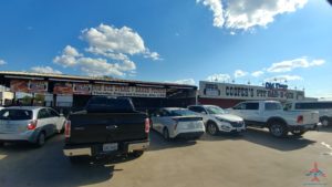 a group of cars parked in a parking lot